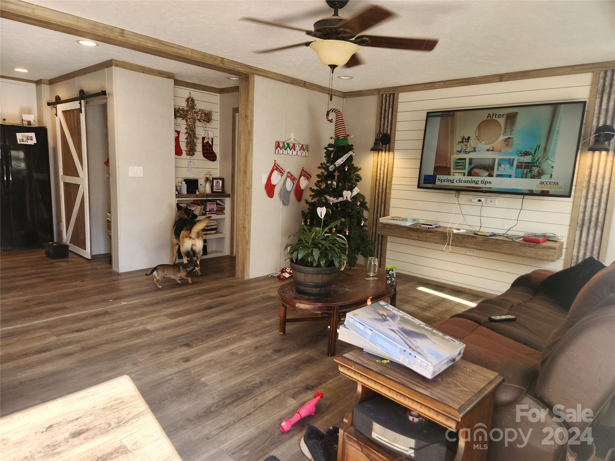 305 Deep Gap Loop Road Flat Rock, NC 28731 - Photo 6 of 7 a living room with furniture and a potted plant