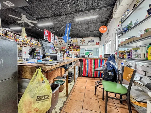 an aerial view of residential houses with outdoor space and parking