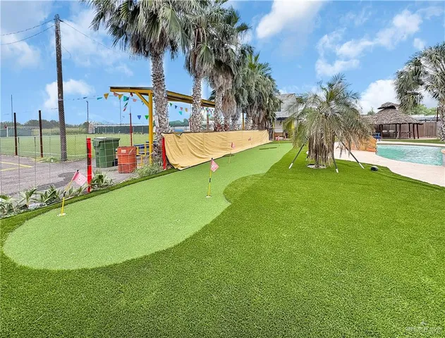 a view of a swimming pool with a garden