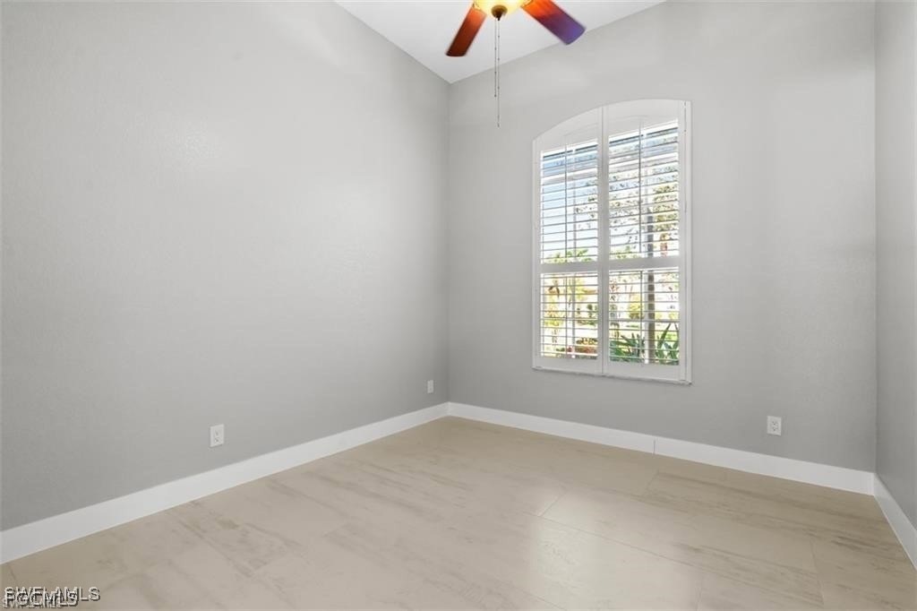 16113 Coco Hammock Way Fort Myers, FL 33908 - Photo 11 of 16 an empty room with a window