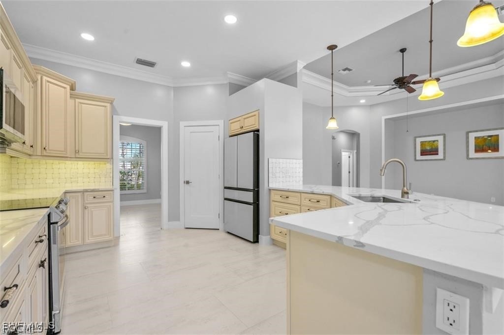16113 Coco Hammock Way Fort Myers, FL 33908 - Photo 3 of 16 a spacious bathroom with a granite countertop sink a toilet a mirror and shower