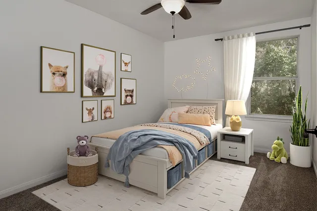 a bedroom with a bed and ceiling fan
