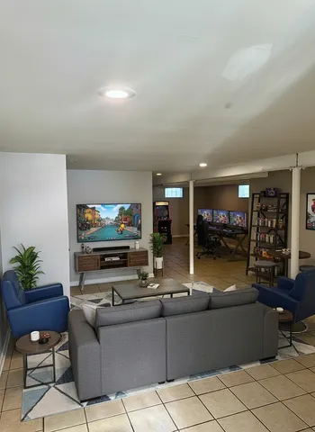 a living room with furniture and a flat screen tv