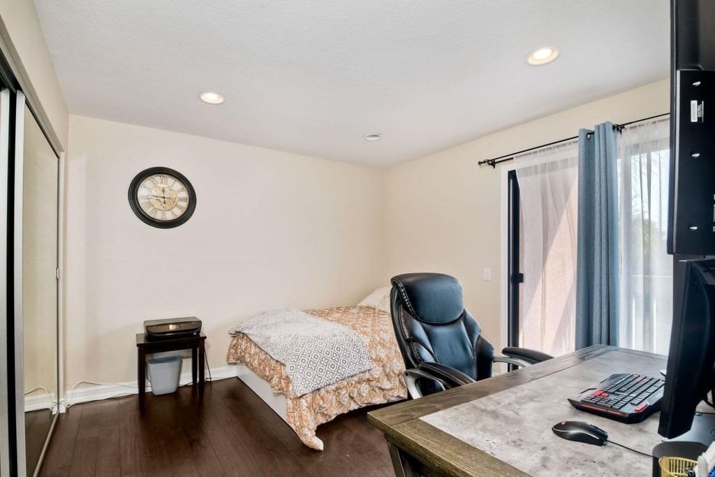 4705 Marina Drive, Unit 5 Carlsbad, CA 92008 - Photo 18 of 30 a bedroom with furniture and a window