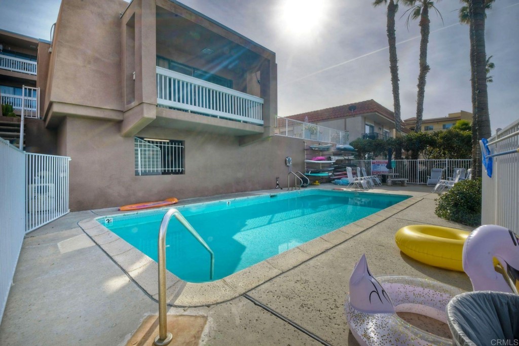 4705 Marina Drive, Unit 5 Carlsbad, CA 92008 - Photo 22 of 30 a view of a swimming pool with a patio