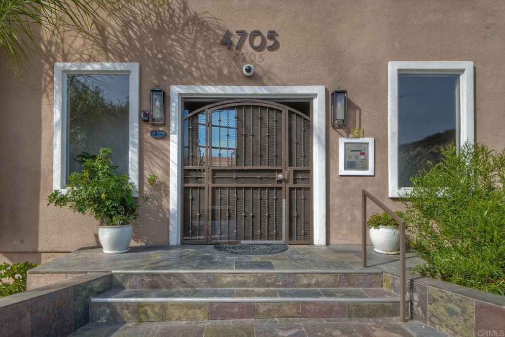 4705 Marina Drive, Unit 5 Carlsbad, CA 92008 - Photo 24 of 30 a front view of a house with a yard