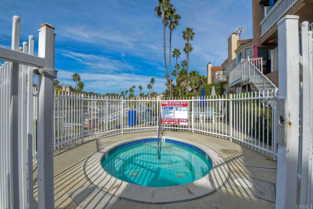 4705 Marina Drive, Unit 5 Carlsbad, CA 92008 - Photo 6 of 30 a balcony with table and chairs