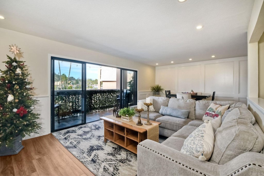 4705 Marina Drive, Unit 5 Carlsbad, CA 92008 - Photo 9 of 30 a living room with furniture and a potted plant