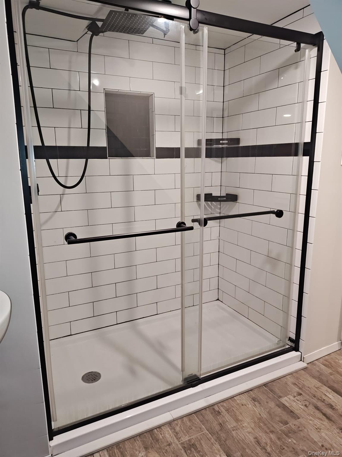 2354 North Wading River Road Wading River, NY 11792 - Photo 14 of 20 Full bath featuring light wood-style flooring and a shower stall