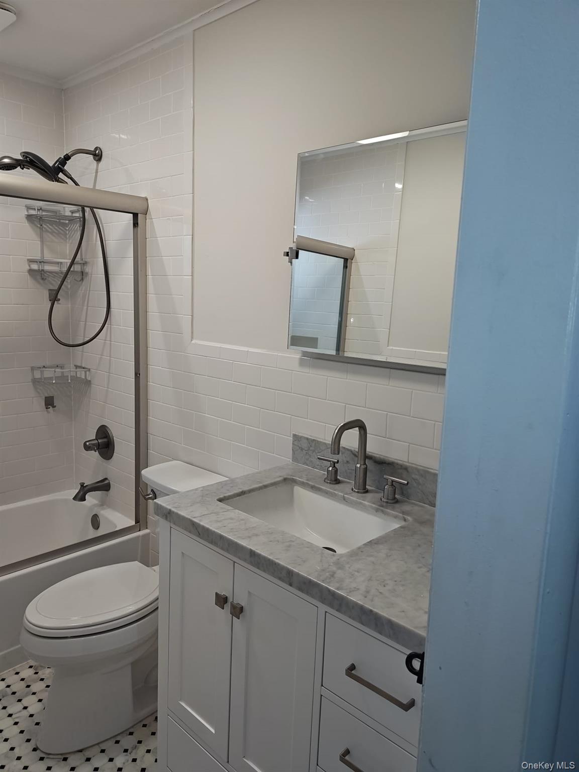2354 North Wading River Road Wading River, NY 11792 - Photo 9 of 20 Full bathroom with tile walls, vanity, shower / bathtub combination, and decorative backsplash