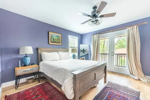 a bed room with a bed and a chandelier