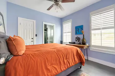 a bedroom with bed and window