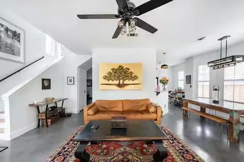 a living room with furniture and a flat screen tv