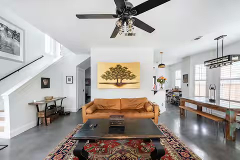 84 Anthony Street Austin, TX 78702 - Photo 4 of 17 a living room with furniture and a flat screen tv
