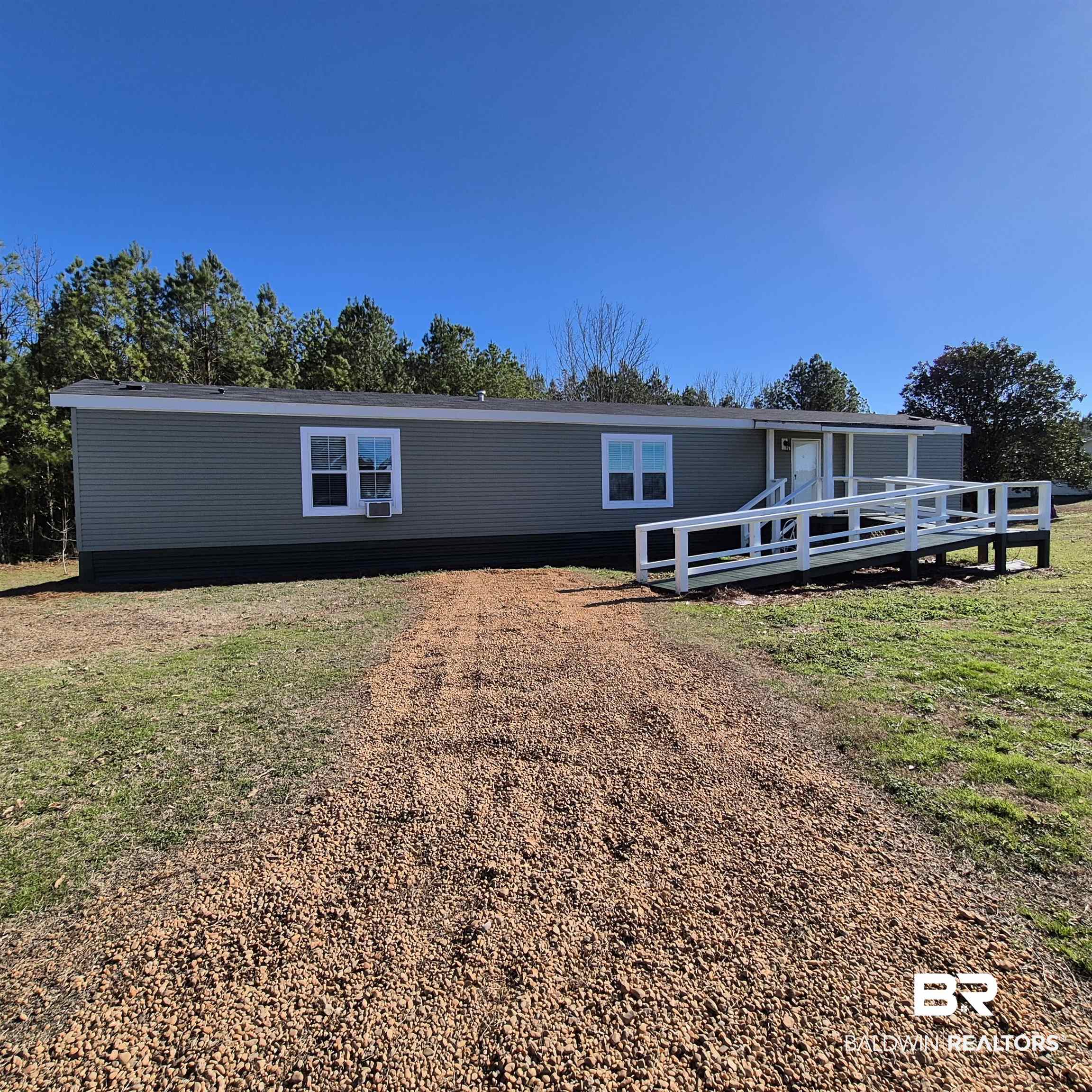 8867 Old Stage Road Repton, AL 36475 - Photo 37 of 37 Manufactured / mobile home with a front lawn