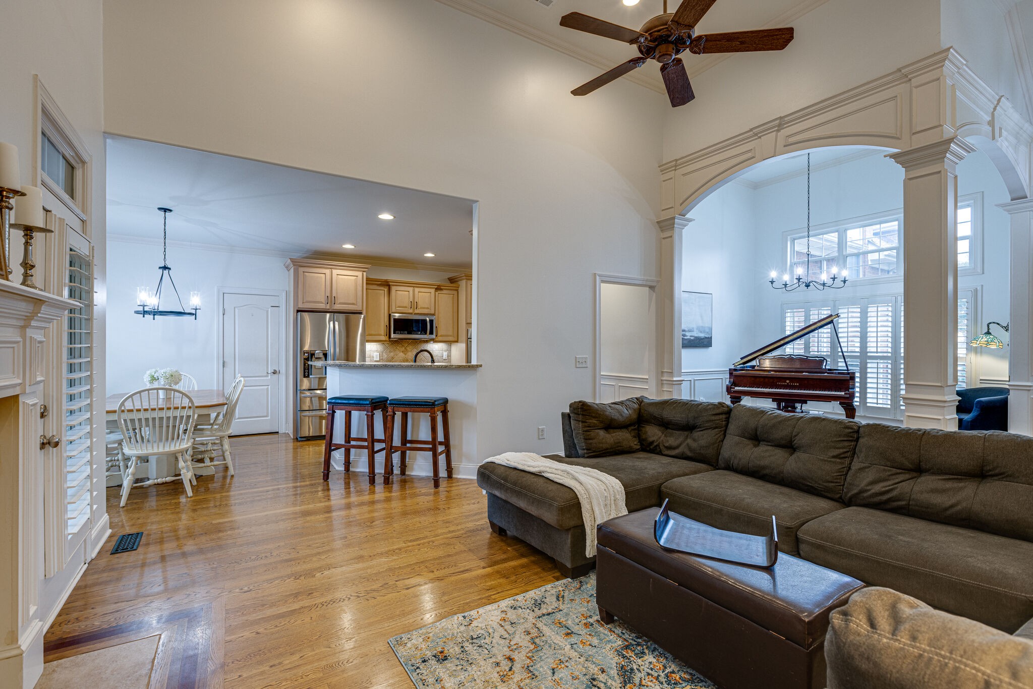 1213 White Rock Road Spring Hill, TN 37174 - Photo 14 of 50 a living room with furniture and a dining table with kitchen view