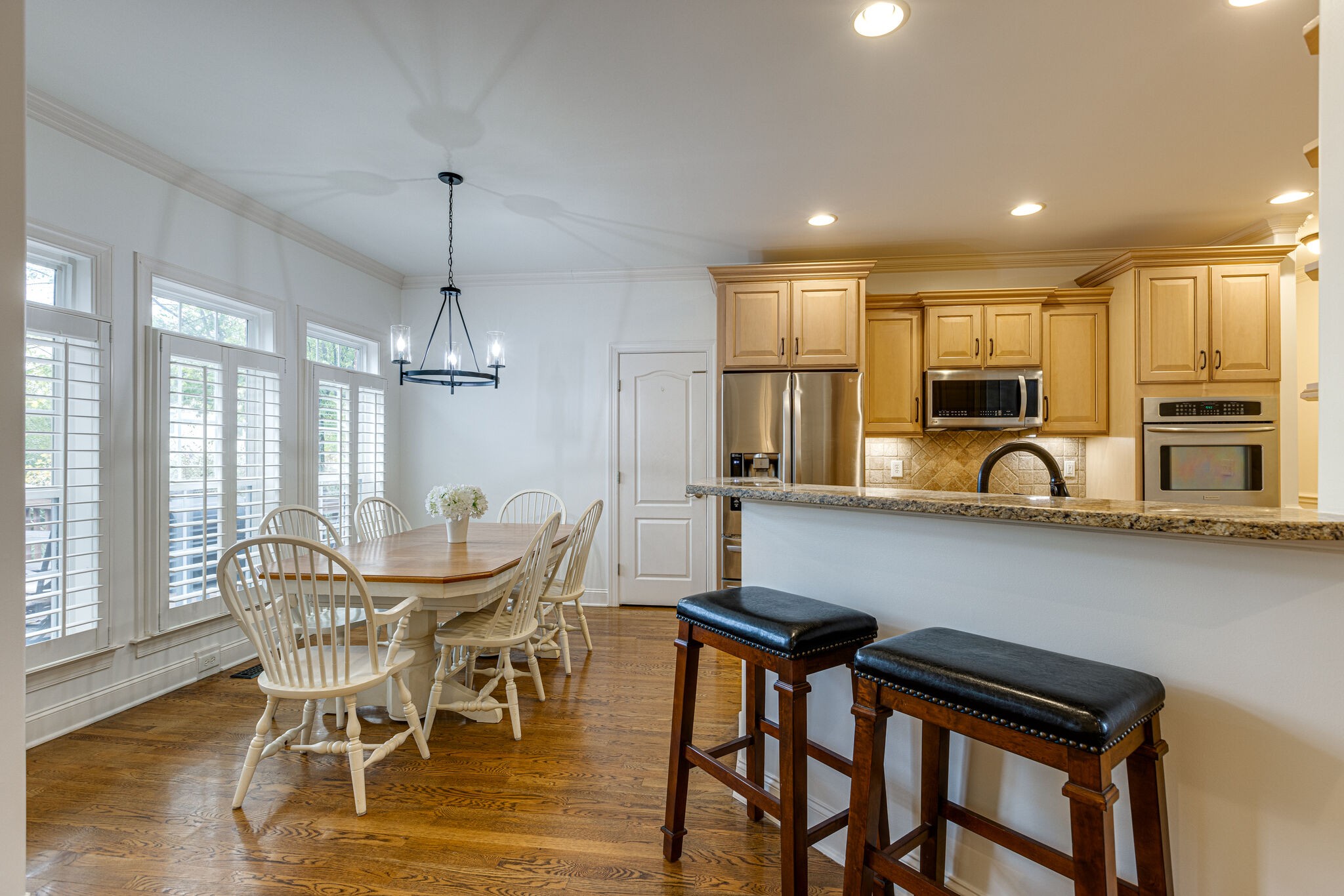 1213 White Rock Road Spring Hill, TN 37174 - Photo 15 of 50 a view of a dining room with furniture window and wooden floor