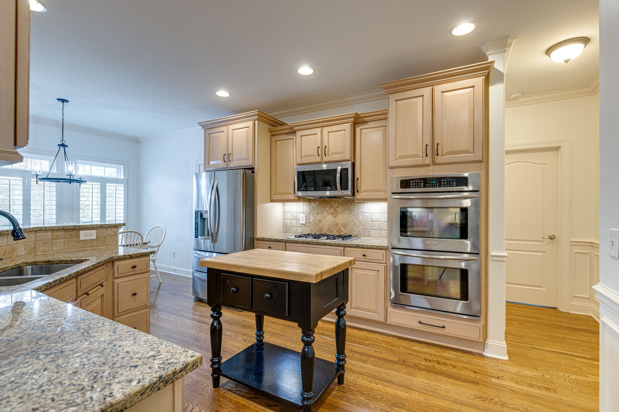 1213 White Rock Road Spring Hill, TN 37174 - Photo 20 of 50 a kitchen with stainless steel appliances granite countertop a stove refrigerator sink and microwave