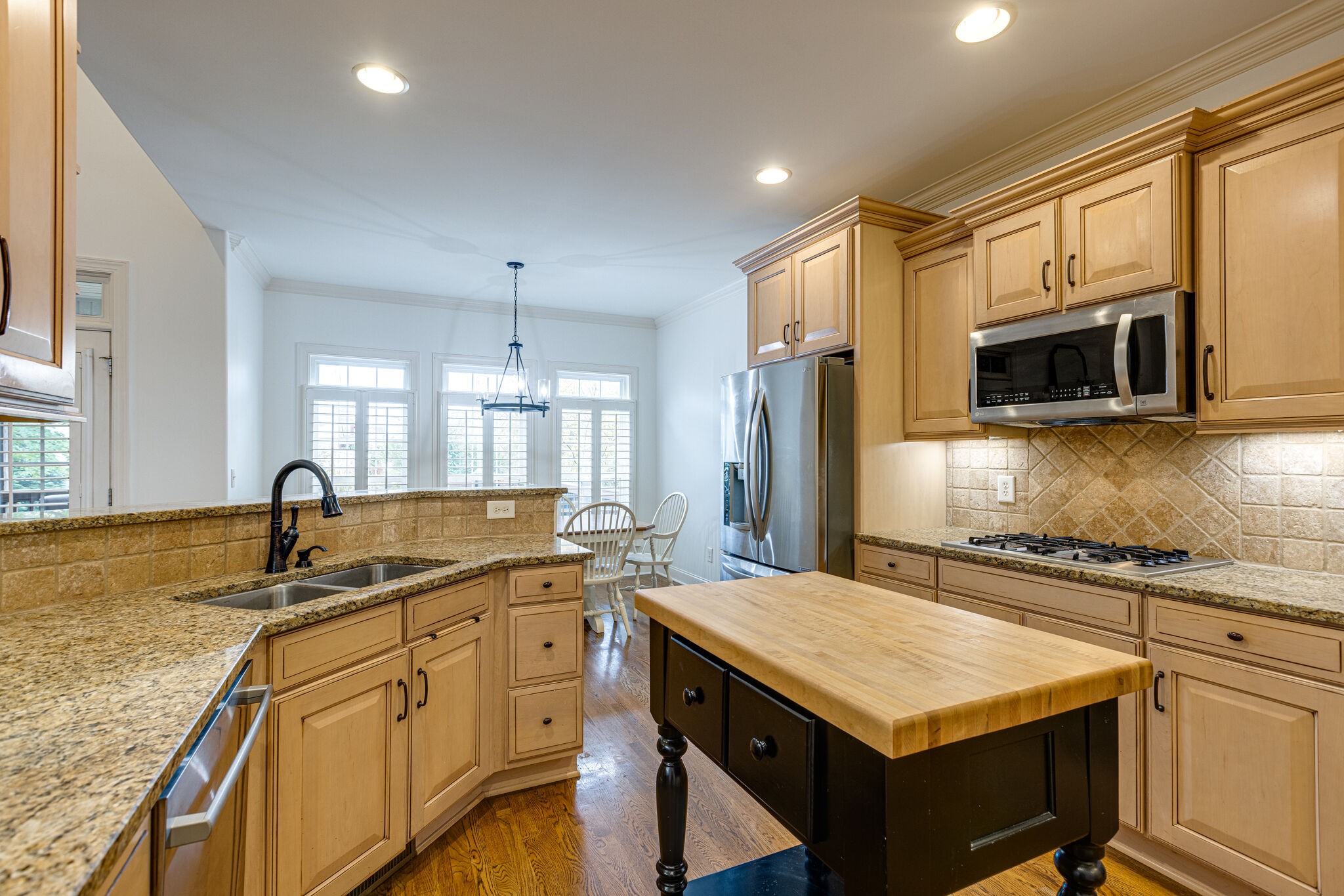 1213 White Rock Road Spring Hill, TN 37174 - Photo 21 of 50 a kitchen with stainless steel appliances granite countertop a sink stove and refrigerator