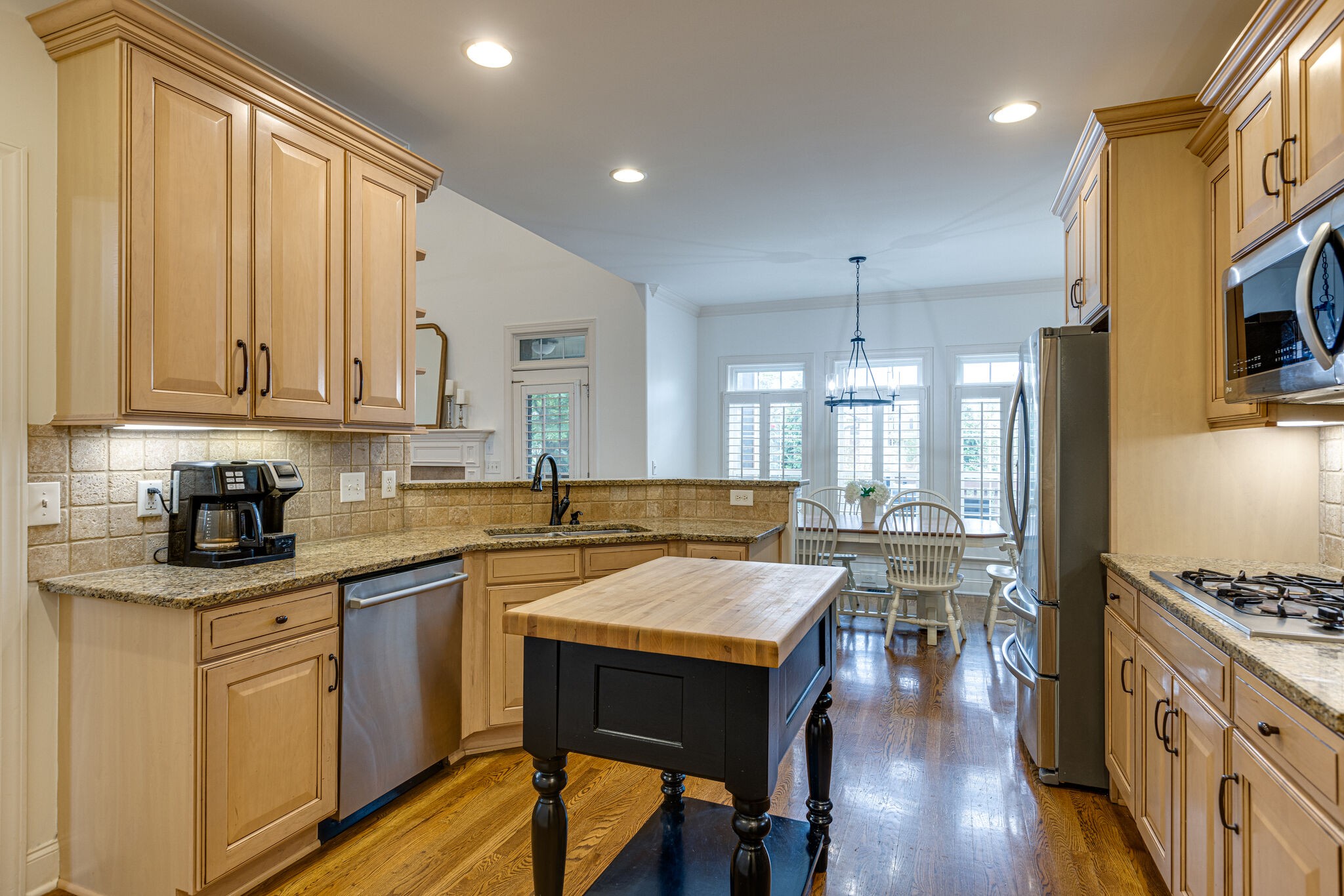 1213 White Rock Road Spring Hill, TN 37174 - Photo 22 of 50 a kitchen with a table chairs stove and cabinets