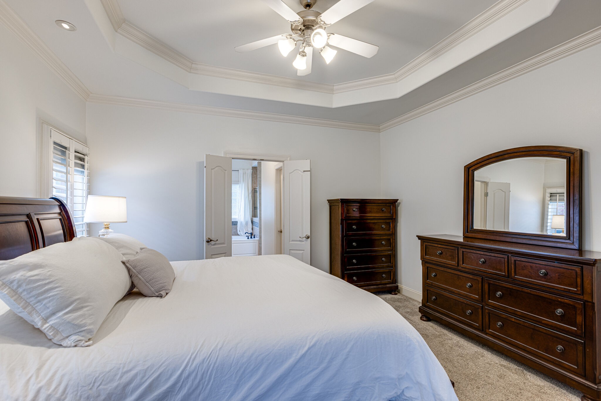 1213 White Rock Road Spring Hill, TN 37174 - Photo 27 of 50 a bedroom with a bed and dresser with mirror