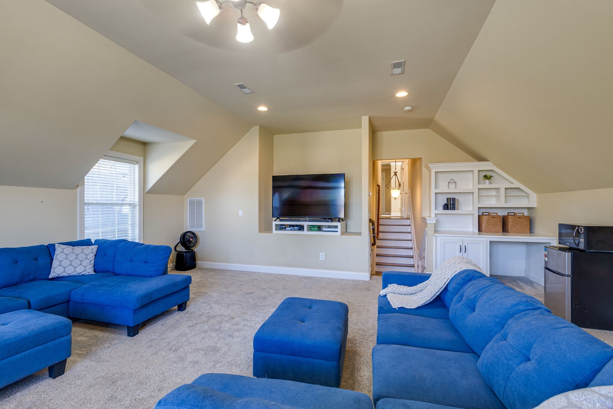 1213 White Rock Road Spring Hill, TN 37174 - Photo 36 of 50 a living room with furniture and a flat screen tv