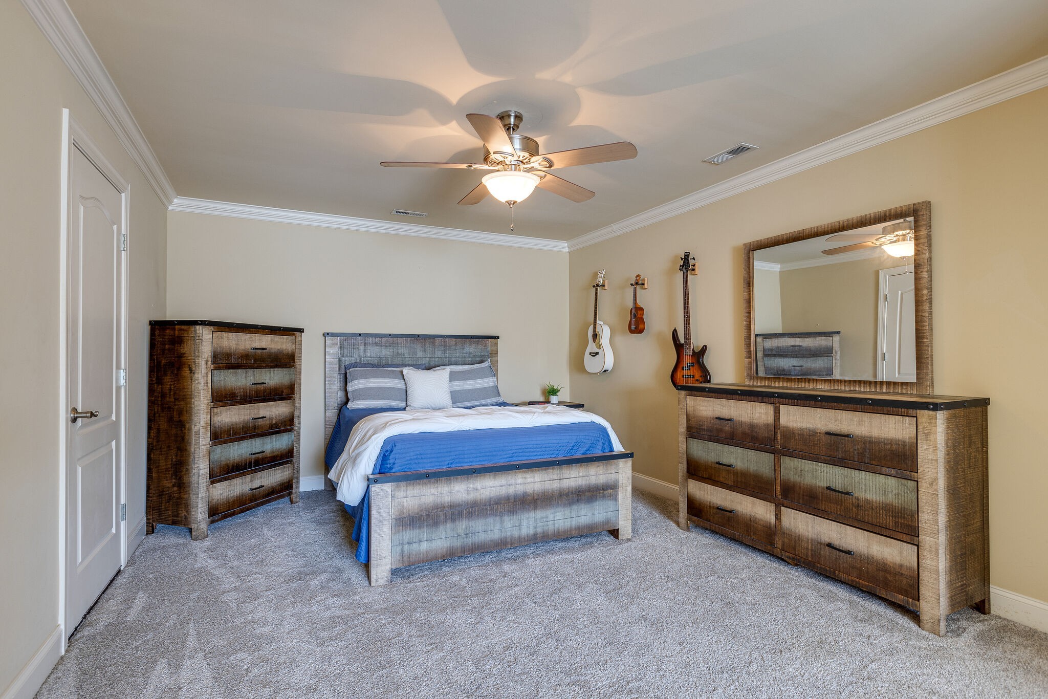 1213 White Rock Road Spring Hill, TN 37174 - Photo 37 of 50 a bedroom with a bed and a chandelier