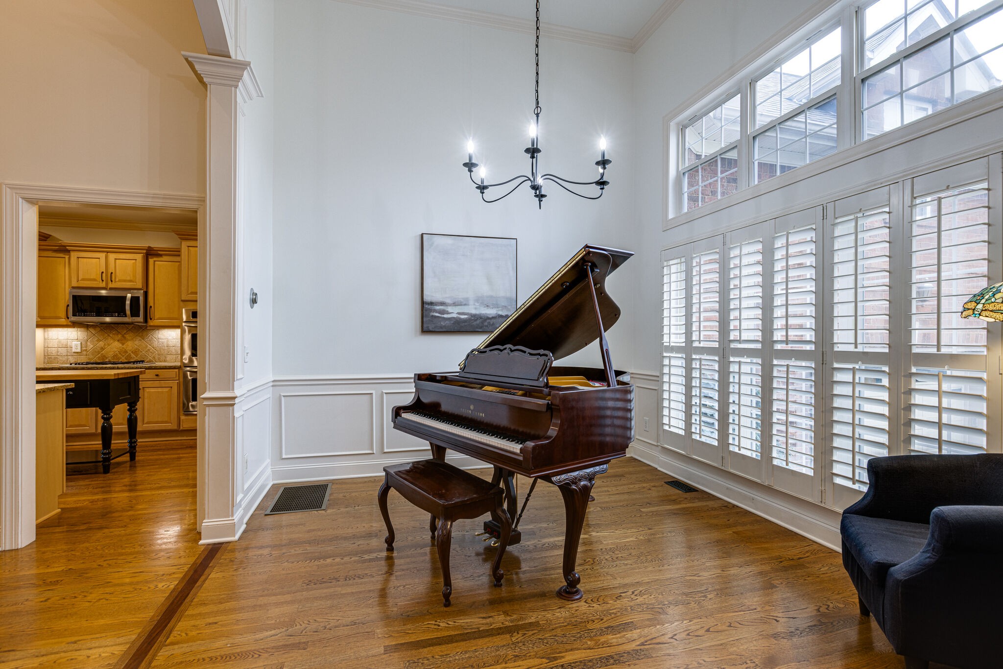 1213 White Rock Road Spring Hill, TN 37174 - Photo 8 of 50 a living room with furniture a piano and a floor to ceiling window
