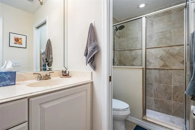 a view of a lake with houses in the back