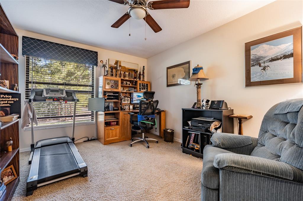 17569 Fairmeadow Drive Tampa, FL 33647 - Photo 18 of 60 a living room with furniture and a flat screen tv