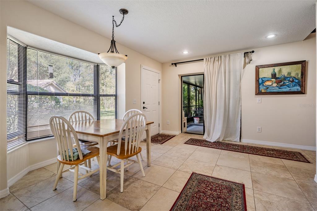 17569 Fairmeadow Drive Tampa, FL 33647 - Photo 21 of 60 a dining room with furniture and window