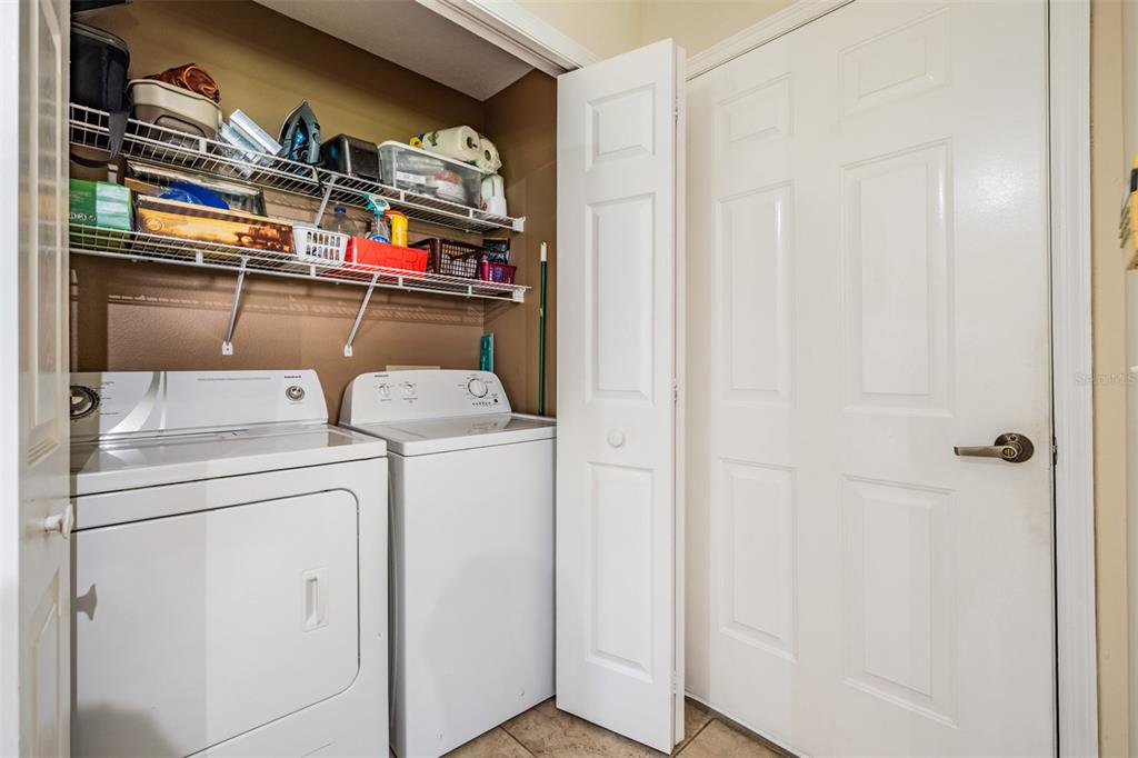 17569 Fairmeadow Drive Tampa, FL 33647 - Photo 27 of 60 a utility room with dryer and washer