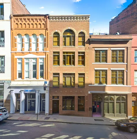 a city street lined with tall buildings