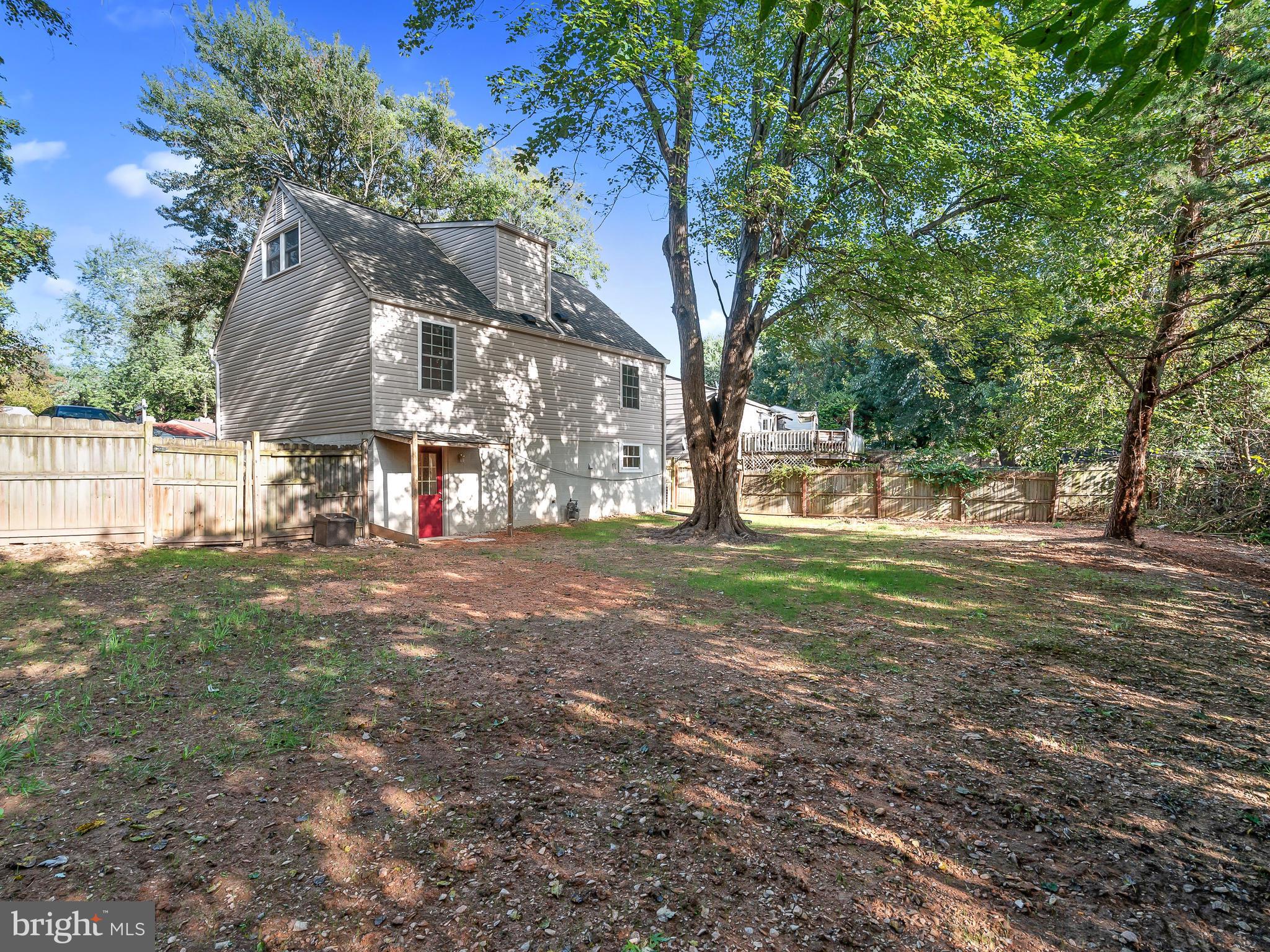 19044 Staleybridge Road Germantown, MD 20876 - Photo 28 of 30 a view of a yard with tree s
