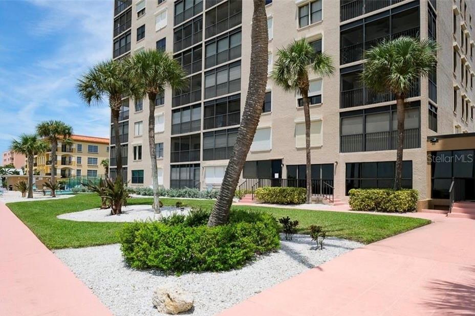 900 Gulf Boulevard, Unit 207 Indian Rocks Beach, FL 33785 - Photo 1 of 1 a front view of building with yard