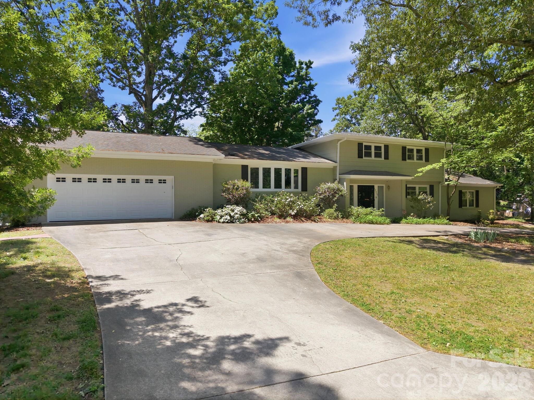 225 Stonewall Road Salisbury, NC 28144 - Photo 1 of 48 a front view of a house with a yard and trees