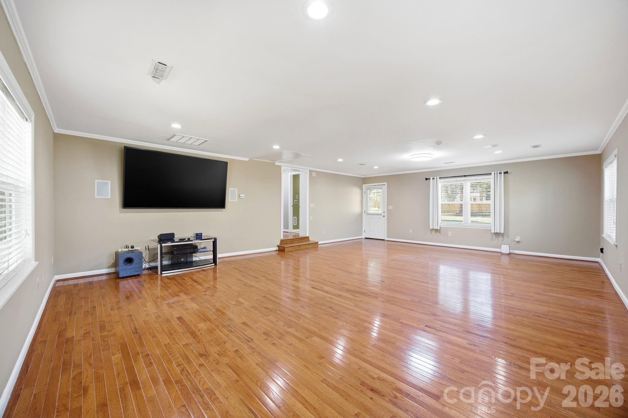 225 Stonewall Road Salisbury, NC 28144 - Photo 13 of 48 a view of a livingroom with furniture and a flat screen tv