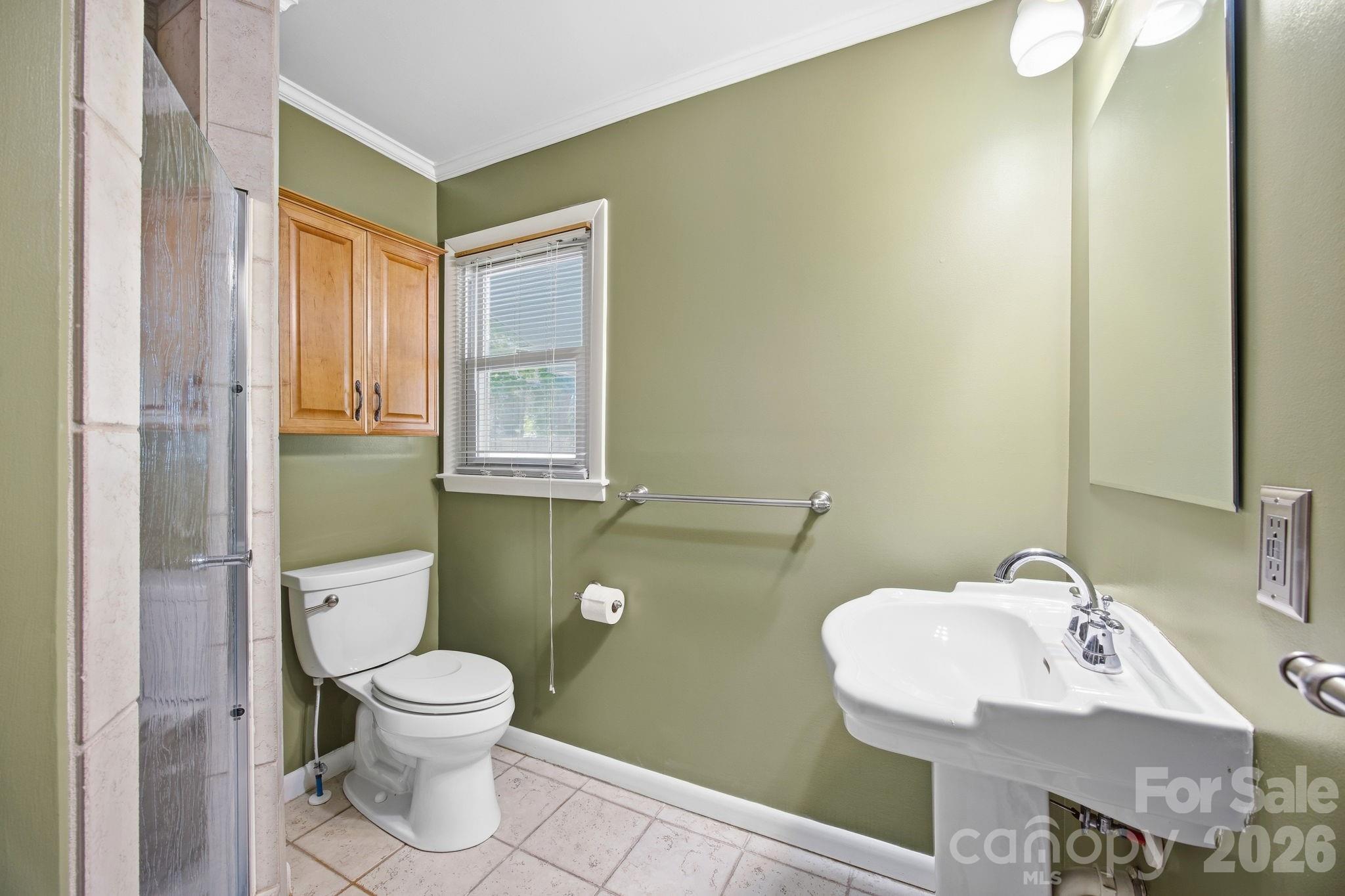 225 Stonewall Road Salisbury, NC 28144 - Photo 15 of 48 a bathroom with a toilet sink and mirror