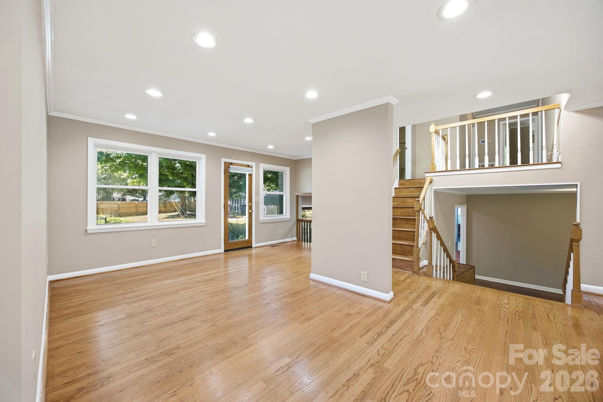 225 Stonewall Road Salisbury, NC 28144 - Photo 17 of 48 an empty room with wooden floor and windows