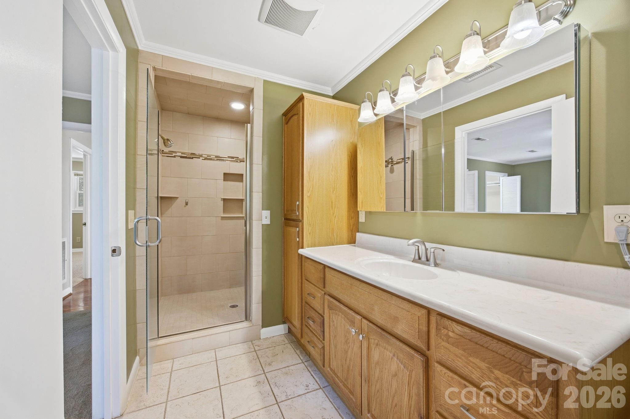 225 Stonewall Road Salisbury, NC 28144 - Photo 30 of 48 a bathroom with a double vanity sink mirror and shower