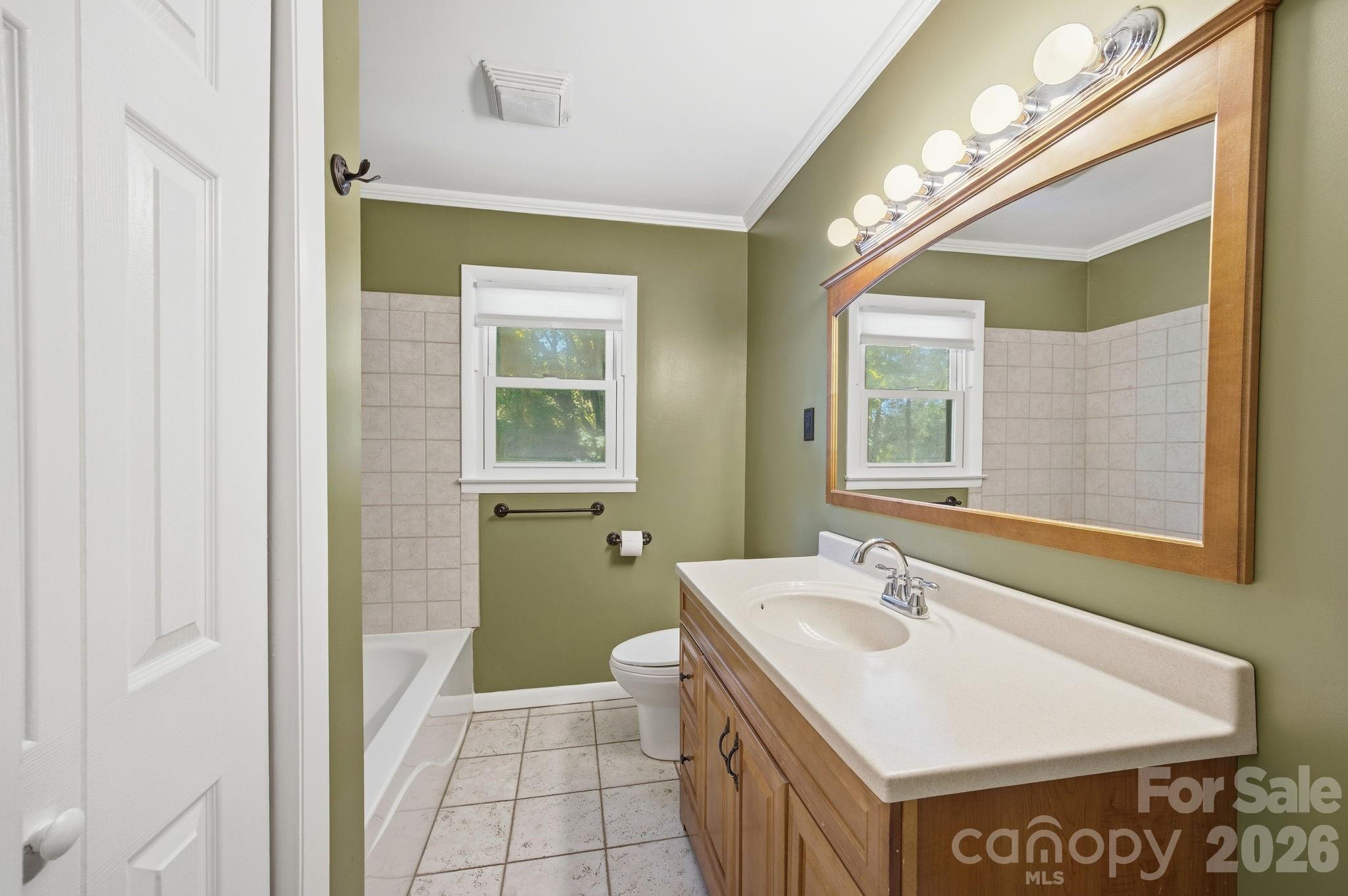 225 Stonewall Road Salisbury, NC 28144 - Photo 33 of 48 a bathroom with a sink a toilet and a mirror