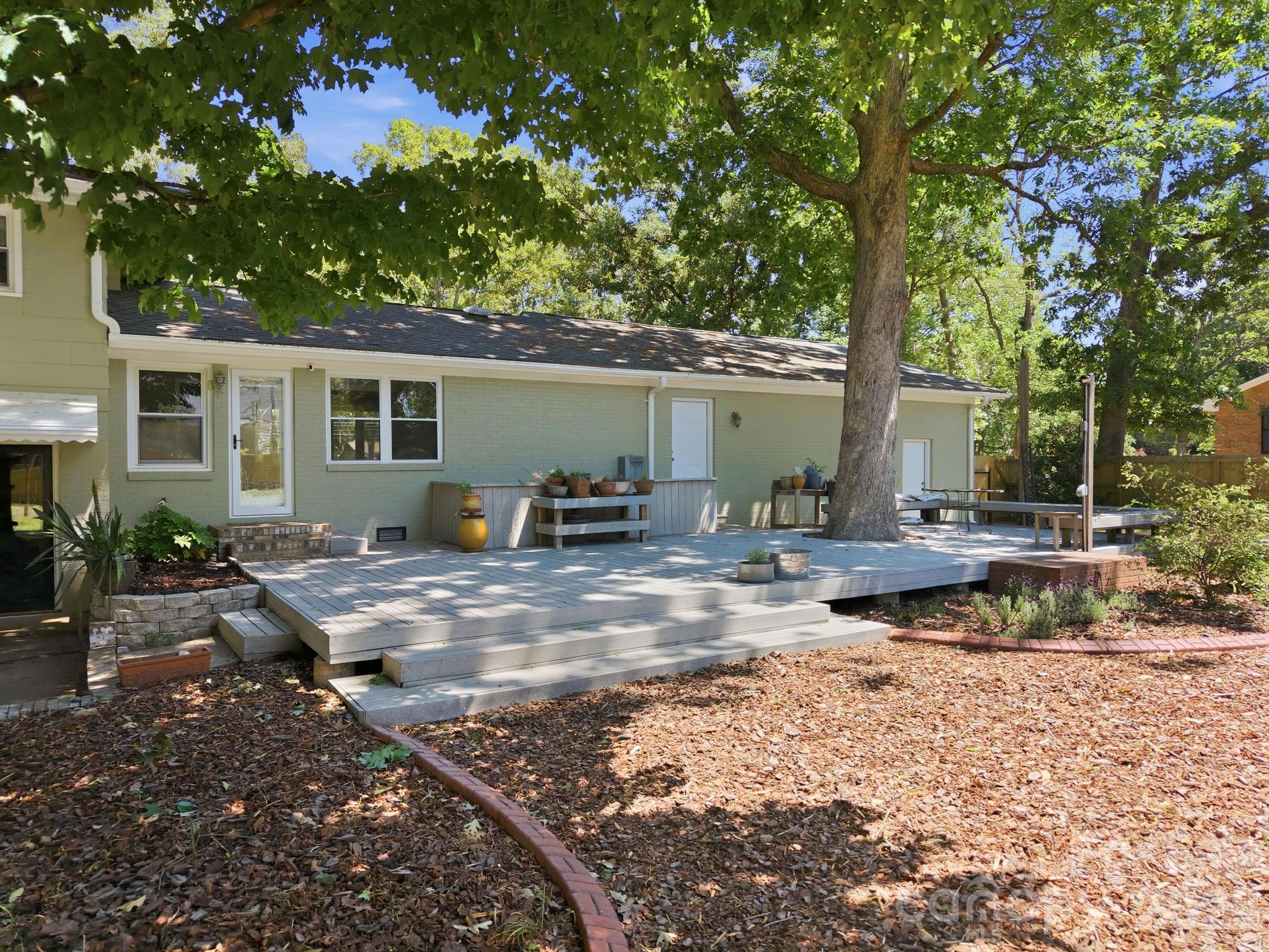 225 Stonewall Road Salisbury, NC 28144 - Photo 47 of 48 a view of backyard of house with wooden deck and seating space