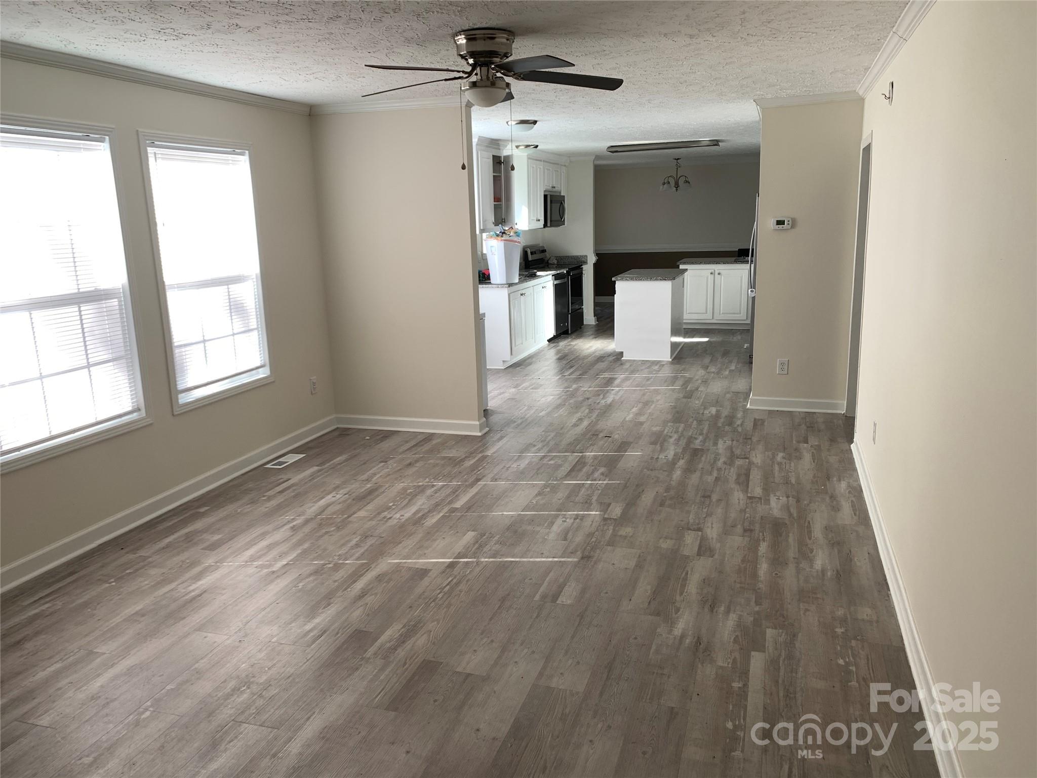 1773 State Rd S-28-32 Kershaw, SC 29067 - Photo 12 of 28 wooden floor in an empty room with a window