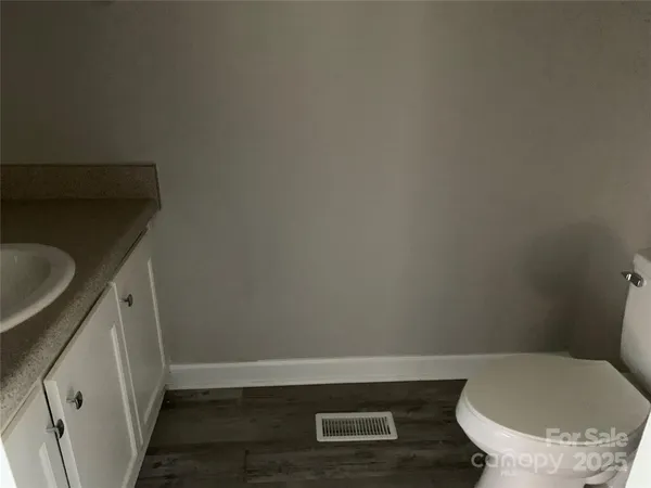 a bathroom with a toilet and a sink
