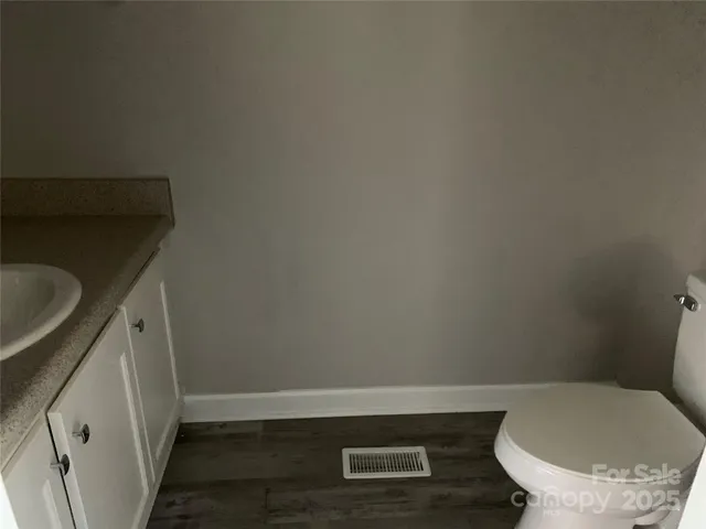 a bathroom with a toilet and a sink