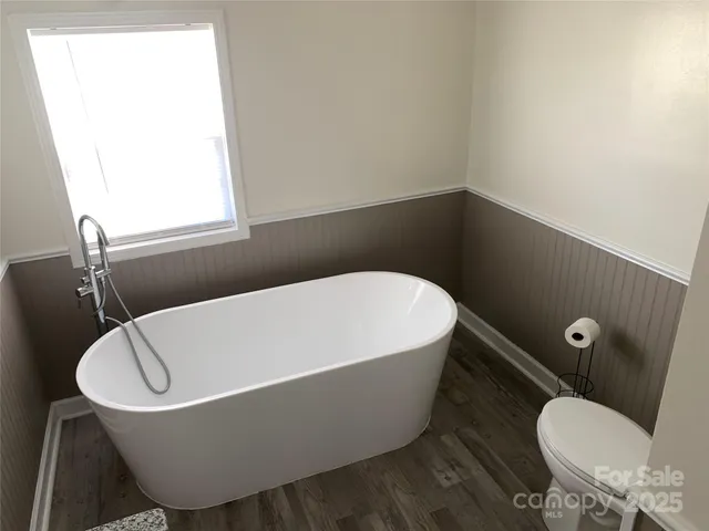 a white tub sitting in a bathroom