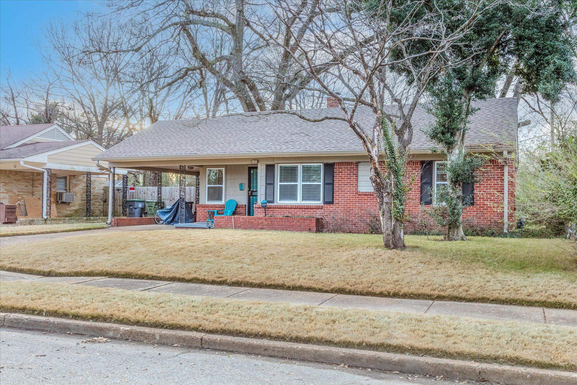 1493 Raymore Road Memphis, TN 38117 - Photo 2 of 27 front view of a house with a yard
