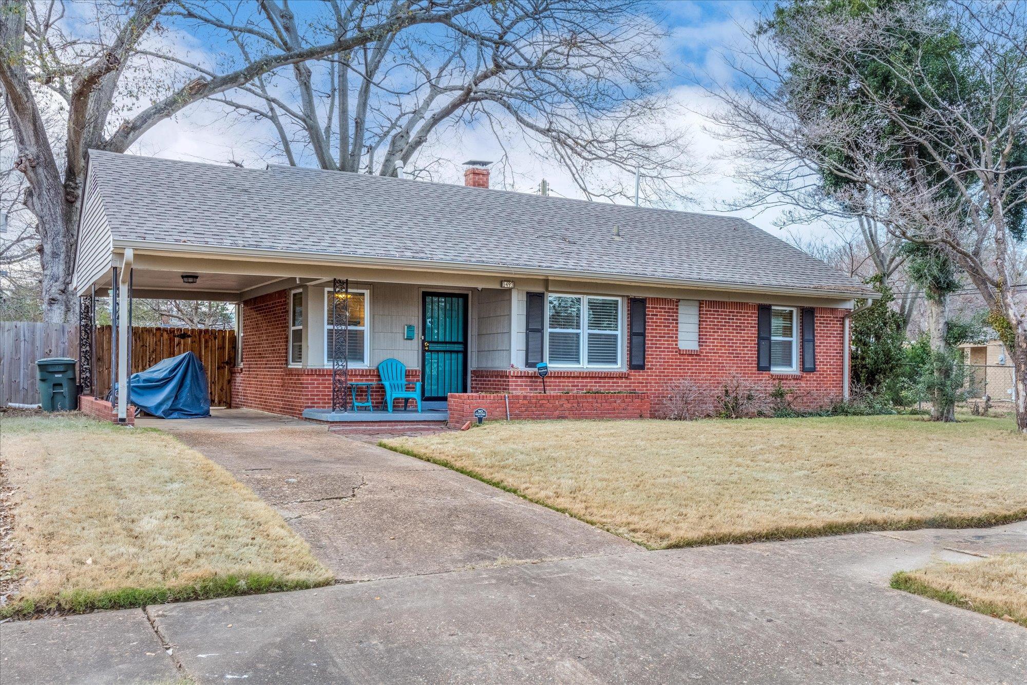 1493 Raymore Road Memphis, TN 38117 - Photo 3 of 27 a view of a house with a yard and large tree