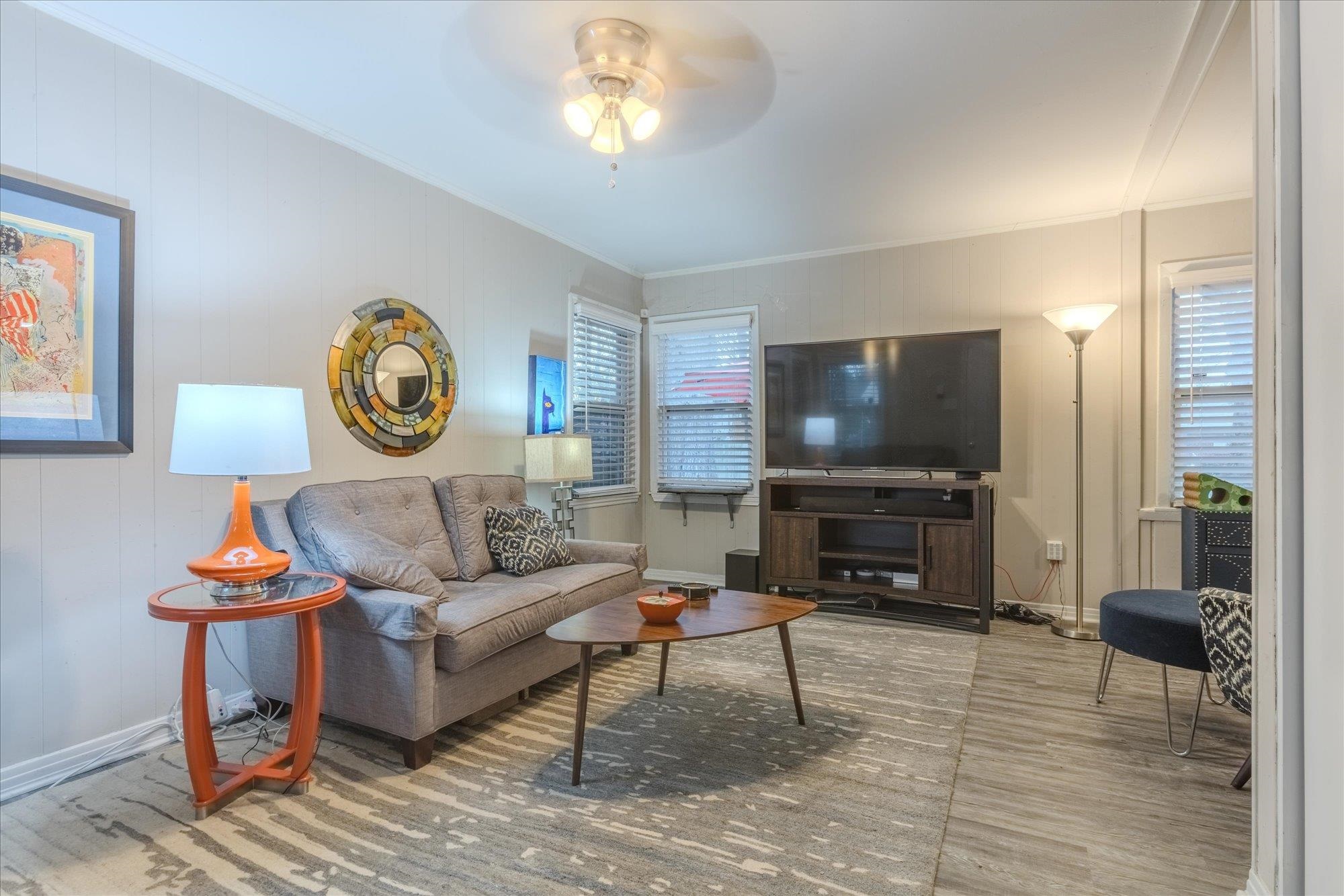 1493 Raymore Road Memphis, TN 38117 - Photo 7 of 27 a living room with furniture and a flat screen tv