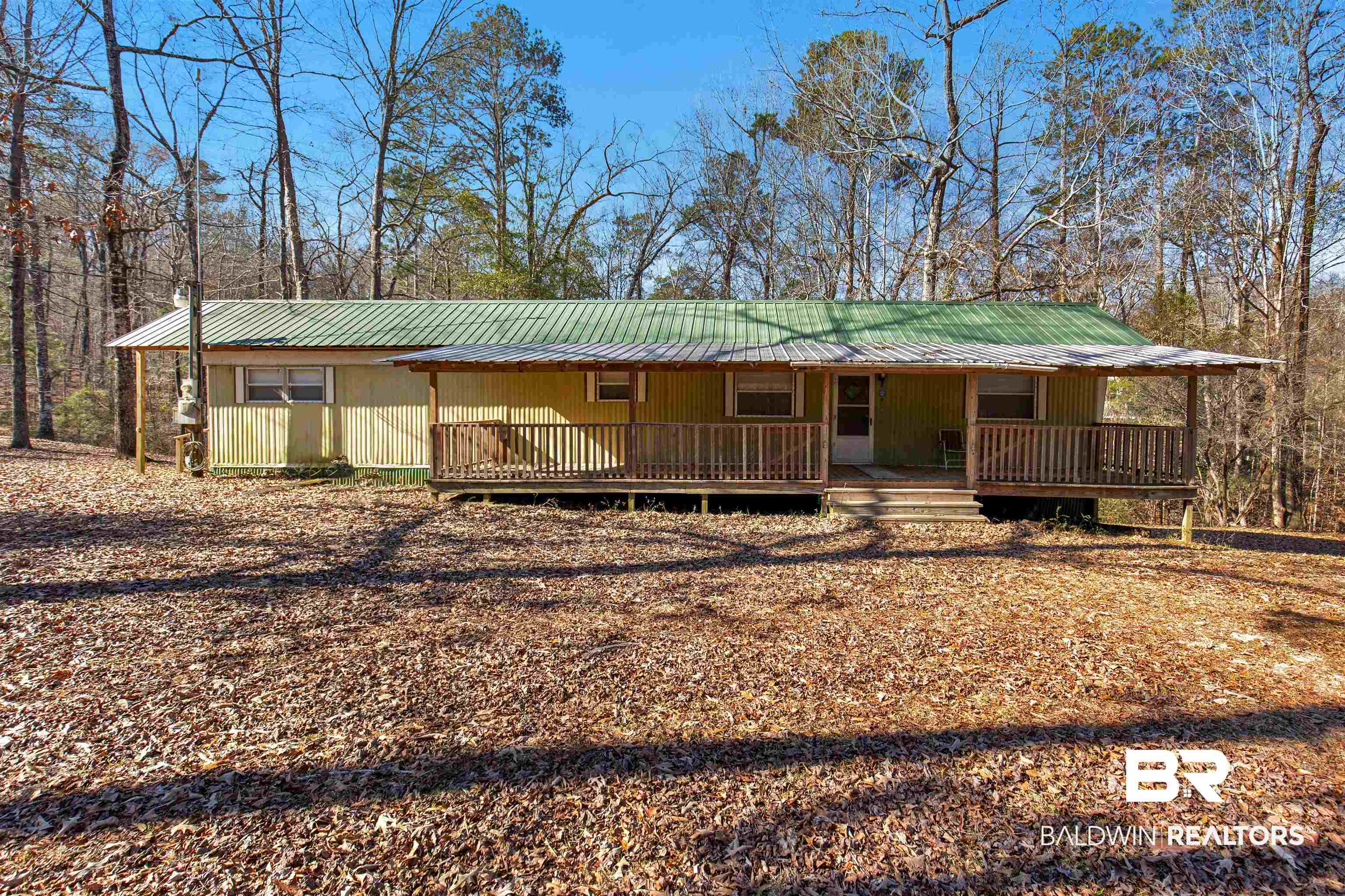 17 Pine Court Camden, AL 36726 - Photo 1 of 32 View of front of property with covered porch and metal roof
